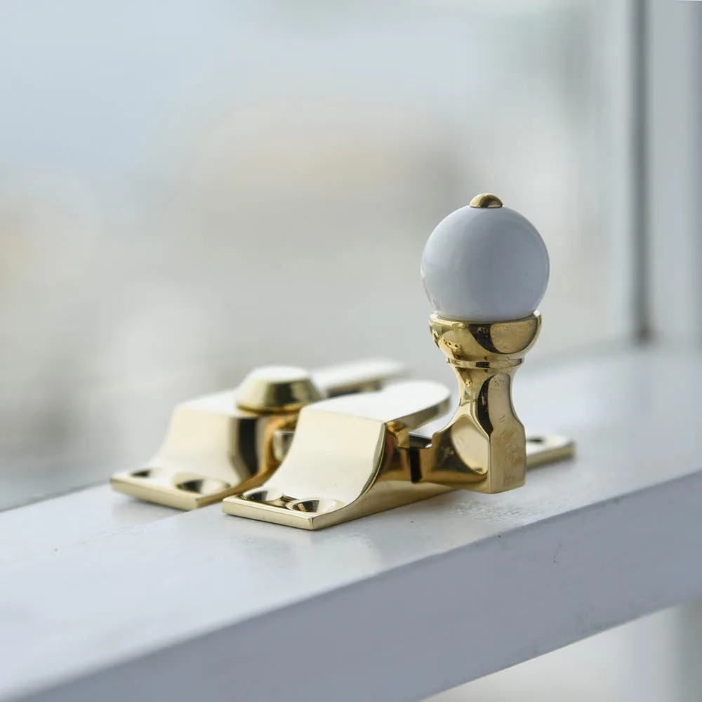 Polished Brass Sash Window Fastener with White Knob